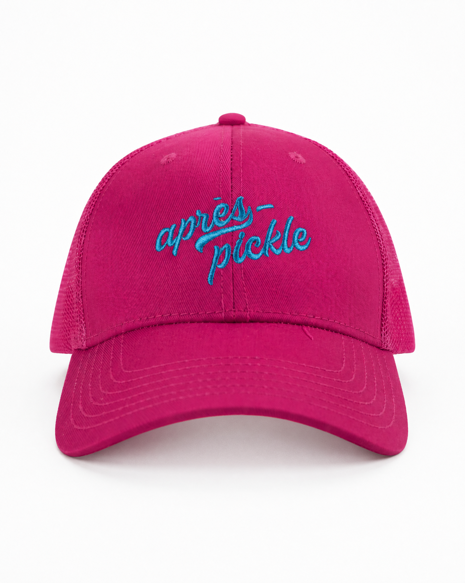 Pink cap with blue text 'apres pickle' on a white background