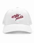 White cap with red text 'apres pickle' on a white background